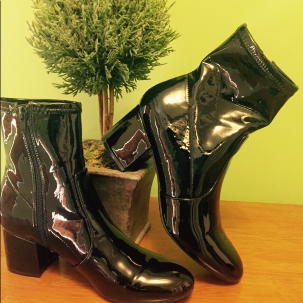 Unisa patten leather booties.